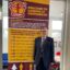Simon Wareham standing in front of a school display titled 'Welcome to Careers at Southmoor'